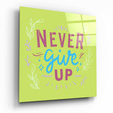 “Never Give Up” Glass Wall Art.